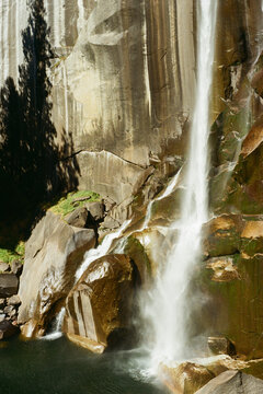 ushing Waterfall Against Dramatic Rock Formations