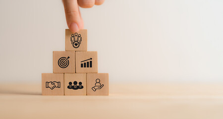 Business trust and success concept. Wooden blocks with trust, teamwork, customer, partner and...