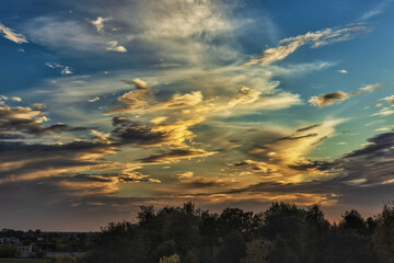 Beautiful sunset with colorful clouds over the horizon in a serene landscape