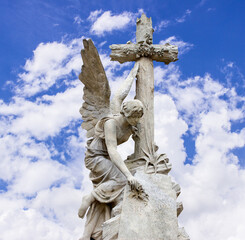 Tired angel warrior resting after battle on sky background