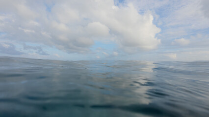 POV of swimming in empty ocean background with calm water
