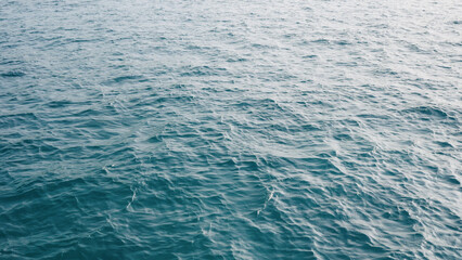 small ripples and waves on Indian ocean with morning light