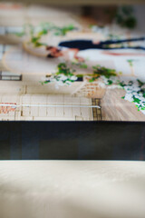 a closed photo book with wedding photos on a white table