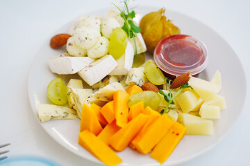 cheese plate on the served festive table