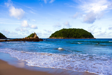 Sea view at Yanui Beach with rock and blue sky in Phuket Thailand