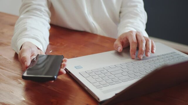 The concept of improving the digital turnover of real estate. Symbolic icons appear against the background of a man working on a laptop. Cg