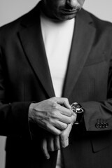 business man holding his watch