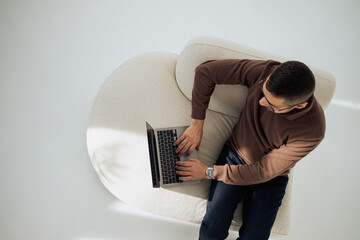 young man using laptop