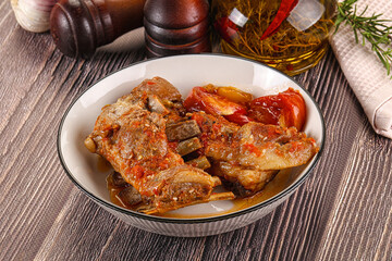 Baked lamb ribs with vegetables