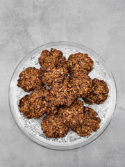 Oatmeal cookies resting on elegant glass plate copy space