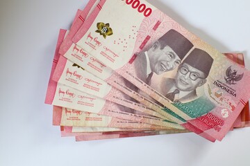 Pile of Indonesian One Hundred Thousand Rupiah Banknotes Close Up