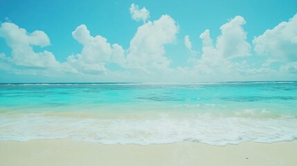Obraz premium A beautiful tropical beach scene with blue ocean and white clouds