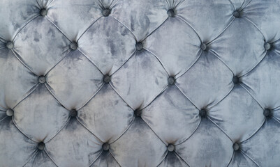 Quilted vintage sofa velour fabric, vintage upholstered furniture, soft gray fabric sofa with sewn-in buttons texture, background