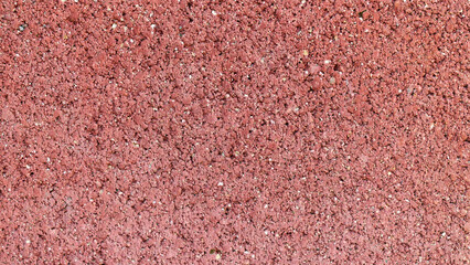 Red cinder block texture background closeup. Grunge and rough surface.