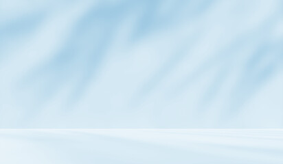 Obraz premium Empty blue room studio with shadow of leaves on concrete wall and floor for product presentation. Sunlight effect shadow. Minimal winter backdrop. Cosmetic, beauty and fashion showroom.