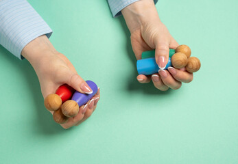 Woman holding figures of people. Concept of personnel management, hiring workers and delegation of tasks. Team building, staffing solutions, or effective workplace organization.