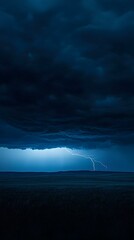 Dramatic nighttime landscape photography featuring a lightning strike over a dark field. Perfect for backgrounds, websites, and design projects.
