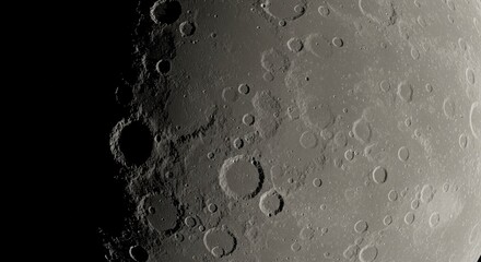 Closeup moon surface with meteorite impact craters.  Space exploration. International Day of Human Space Flight, World Space Week. Black and white minimalist lunar texture. Monochrome interior poster.