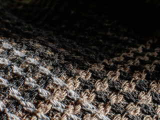 Woven wool fabric with intricate texture details