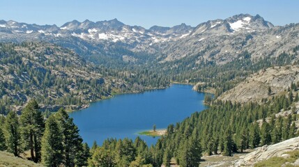 A beautiful lake surrounded by forests and towering snow capped mountains