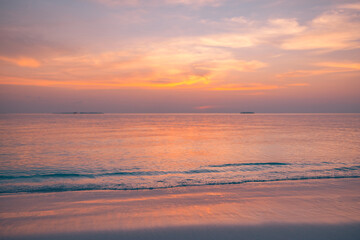 Serenity closeup sea sand beach. Amazing nature landscape. Inspire tropical beach seascape horizon. Orange gold sunset sky peaceful tranquil relaxing sunlight summer mood. Vacation travel holiday