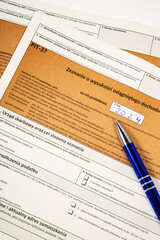 Obraz premium Close-up. Background. PIT-37. Polish tax return form for 2024 (called PIT) with pen.
