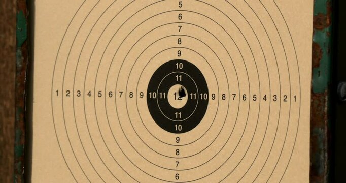 Target practice at shooting range with a competitive atmosphere and focused participants aiming for precision