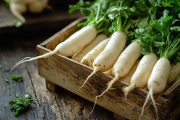 Fresh daikon radishes in a rustic wooden crate on a dark wooden table.