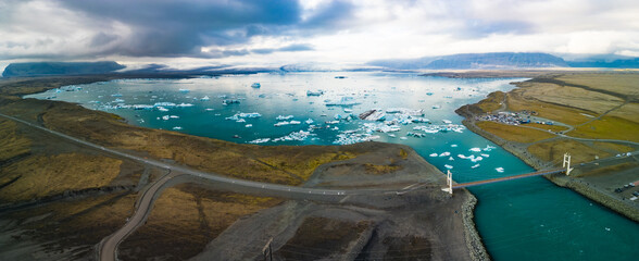 South Iceland, Diamond Beach. Beach with sparkling icebergs at sunset.