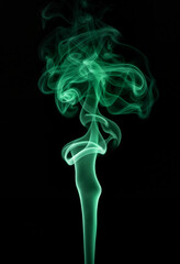 Obraz premium Radiant malachite smoke swirling on black background, ethereal beauty