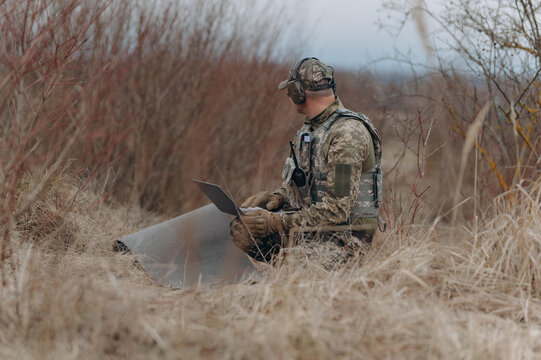 Soldier Analyzing Data in Natural Surroundings