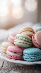 Obraz premium A delightful assortment of colorful macarons in pastel hues, arranged in a visually appealing pile on a tray.