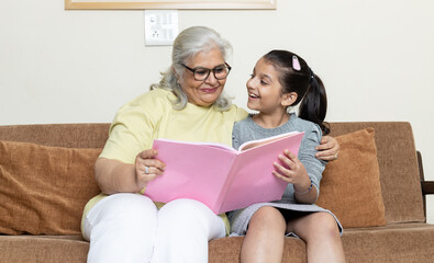 Little grandchild and grandmother playing together ,Retired life	
