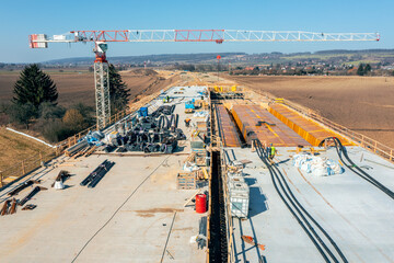 Construction of Highway D35, including the installation of a new concrete bridge.