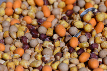 Colorful blend of seeds and grains creating a vibrant natural display for wildlife feeding