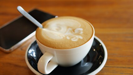 Freshly brewed cappuccino sets mood for perfect start Morning ritual of savoring cappuccino creates cozy peaceful vibe Cappuccino with rich foam brings warmth comfort joy and daily energy boost