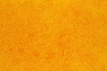 A vibrant, textured yellow background with subtle variations in tone creating a rustic or aged appearance.