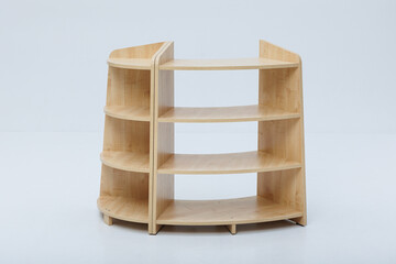A wooden shelf with three distinct shelves on a white background