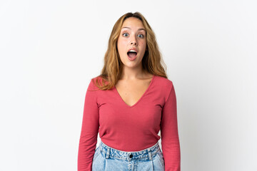 Young blonde woman isolated on blue background with surprise facial expression