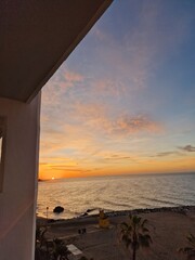 Tranquil Sunset Over a Palm-Fringed Beach