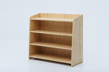 A wooden shelf that features three shelves set against a white background