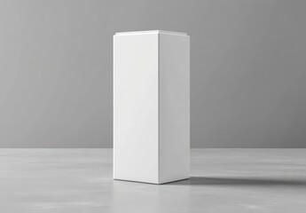 Presenting Tall White Display Pedestal in Minimalist Studio Setting for Products