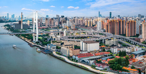 Naklejka premium Aerial view of cityscape with bridge and river in Shanghai, China
