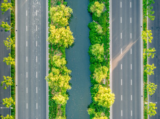 Aerial view of highway with green median and trees