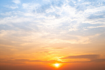 Obraz premium Beautiful , luxury soft gradient orange gold clouds and sunlight on the blue sky perfect for the background, take in evening,Twilight, Large size, high definition landscape photo