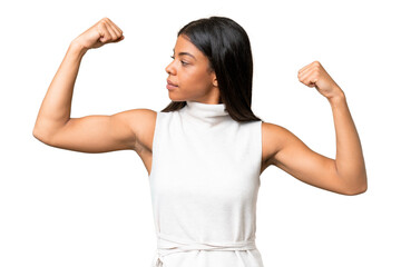 Young African american woman over isolated background doing strong gesture
