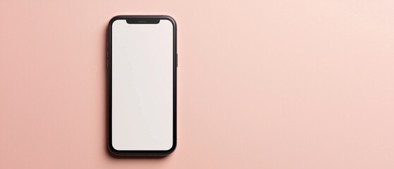 Flat lay of a black smartphone with a blank white screen on a light pink background. the phone is positioned in the center of the image, with the front facing towards the left side of the frame.
