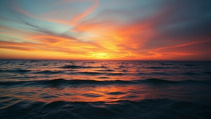 Fototapeta premium Experience enchantment of a sunset painting sky with vivid hues tranquil rhythm of waves and breatht