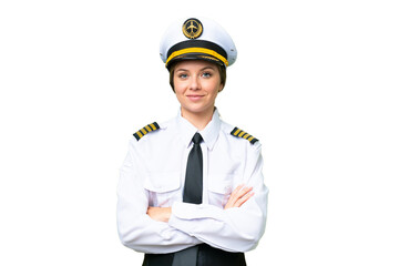 Airplane pilot woman over isolated chroma key background keeping the arms crossed in frontal position