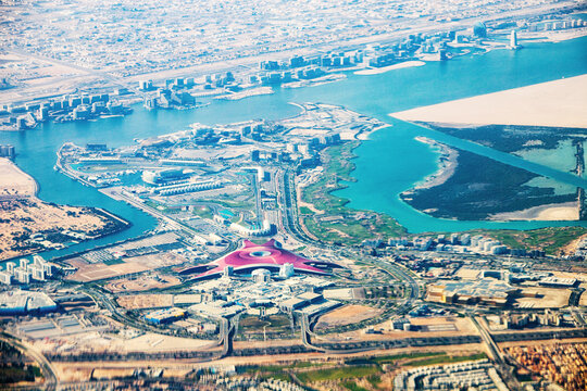23 January 2025, Abu Dhabi, UAE: Stunning aerial view of Yas Island, showing the Formula 1 circuit and the iconic Ferrari World theme park